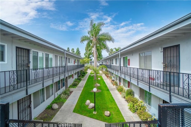 view of home's community with a lawn