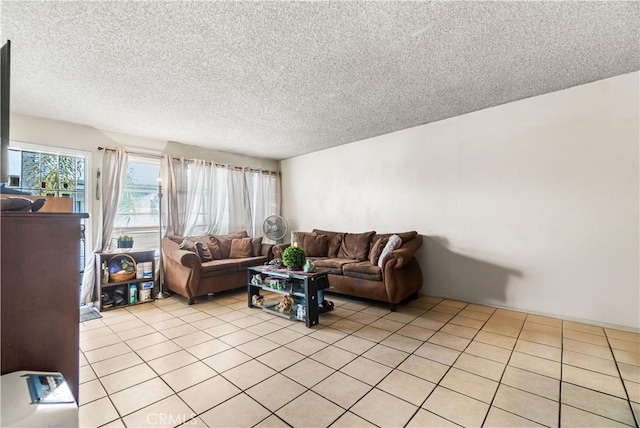 living room featuring light tile patterned flooring and a textured ceiling