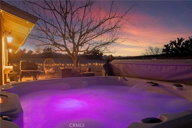 pool at dusk with fence