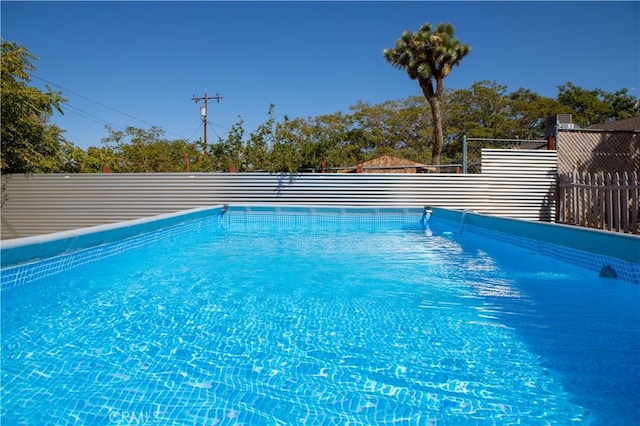 view of pool featuring a fenced in pool and fence