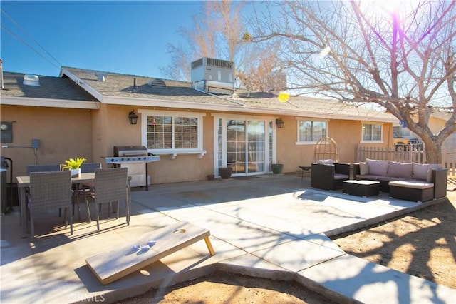 view of patio / terrace with fence, outdoor dining area, an outdoor hangout area, central air condition unit, and a grill