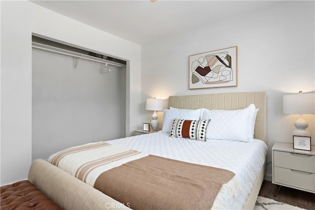 bedroom featuring wood finished floors