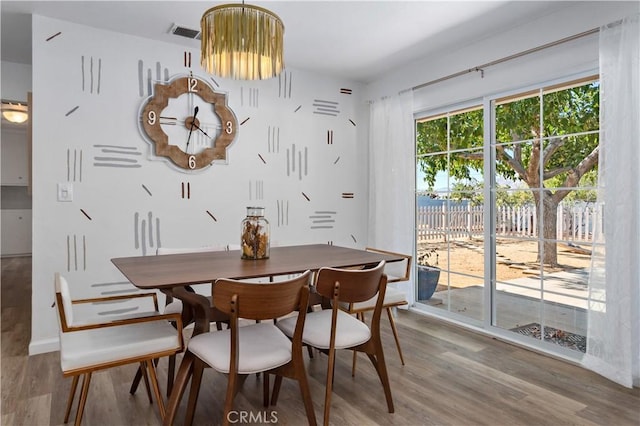 56838 Bonanza Dr, Yucca Valley, CA 92284 - dining space featuring wood finished floors and baseboards