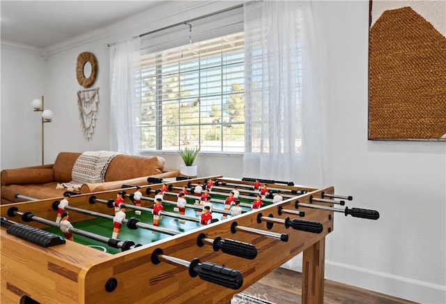 56838 Bonanza Dr, Yucca Valley, CA 92284 - rec room with baseboards, wood finished floors, plenty of natural light, and ornamental molding
