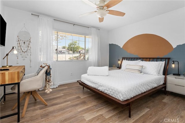 56838 Bonanza Dr, Yucca Valley, CA 92284 - bedroom featuring wood finished floors, baseboards, and a ceiling fan