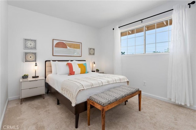 bedroom with baseboards and carpet flooring