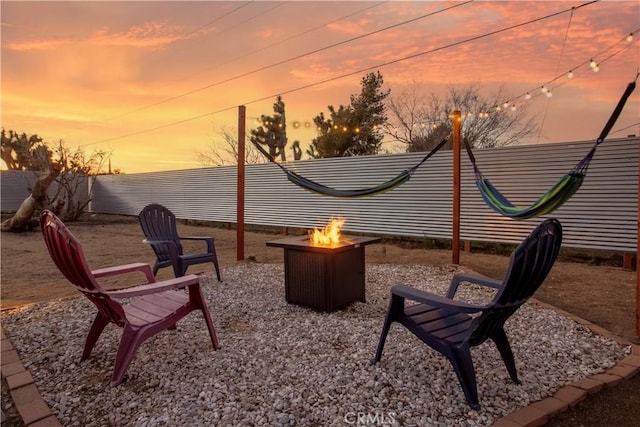56838 Bonanza Dr, Yucca Valley, CA 92284 - patio terrace at dusk with a fire pit