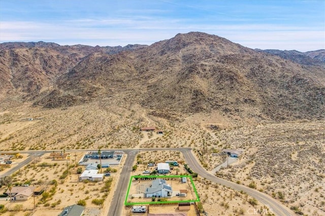 drone / aerial view featuring view of desert and a mountain view