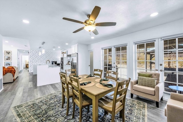 dining area featuring recessed lighting, french doors, light wood-style floors, and ceiling fan