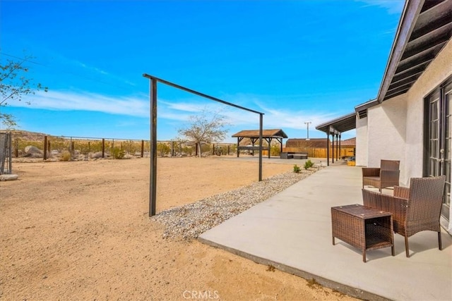 7068 Eucalyptus Ave Unit 29, Palms, CA 92277 - view of home's community with a fenced backyard and a patio area