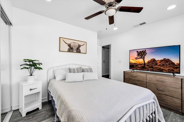 bedroom with dark wood finished floors, recessed lighting, and visible vents