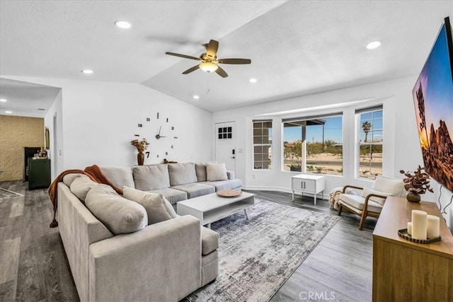 living area featuring recessed lighting, ceiling fan, lofted ceiling, and wood finished floors