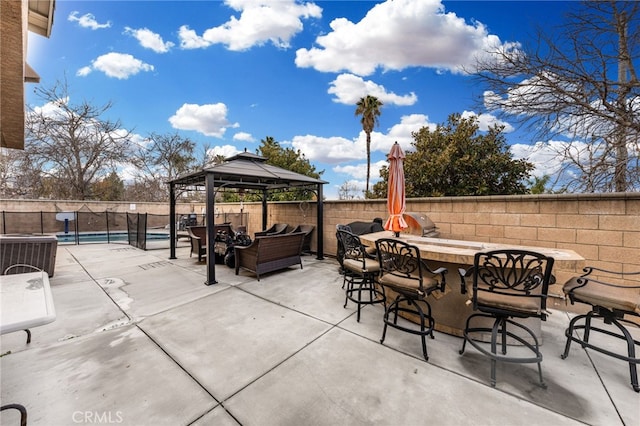 view of patio / terrace featuring outdoor dry bar, a fenced backyard, a gazebo, cooling unit, and a fenced in pool