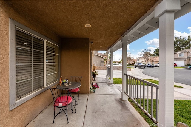 view of patio / terrace featuring a residential view and a porch