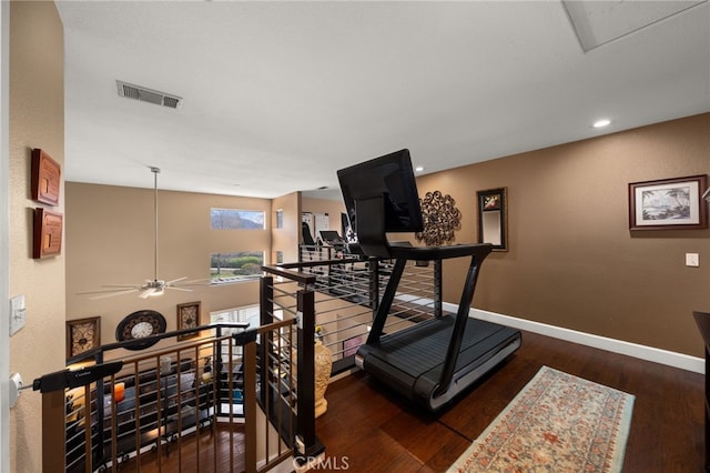 exercise area with visible vents, recessed lighting, baseboards, and wood-type flooring