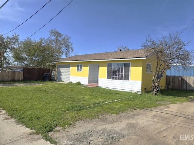bungalow-style house featuring fence, entry steps, and a front yard