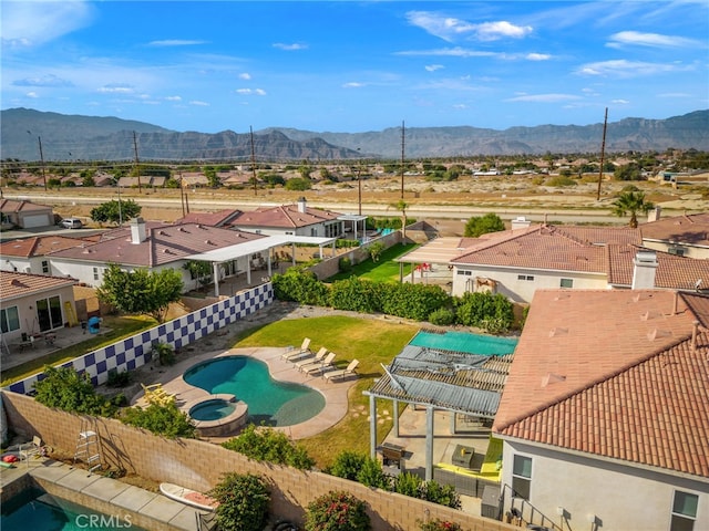 drone / aerial view with a mountain view and a residential view