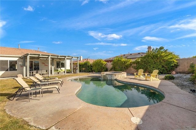 view of pool with a patio, a fenced backyard, and a pool with connected hot tub