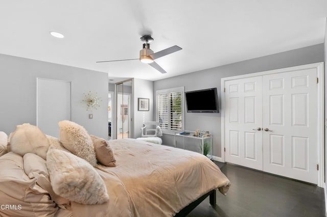 bedroom with dark wood finished floors, baseboards, and a ceiling fan