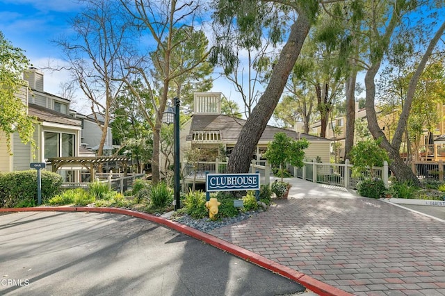 exterior space featuring fence and a gate