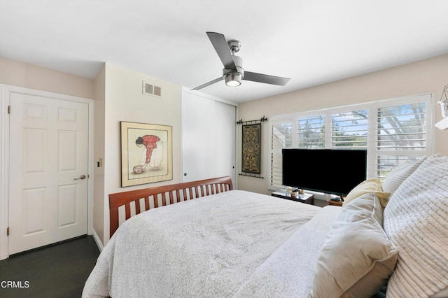 bedroom featuring visible vents, baseboards, and ceiling fan