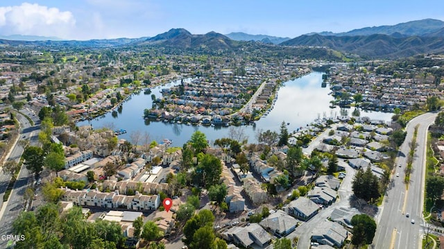 bird's eye view with a residential view and a water and mountain view