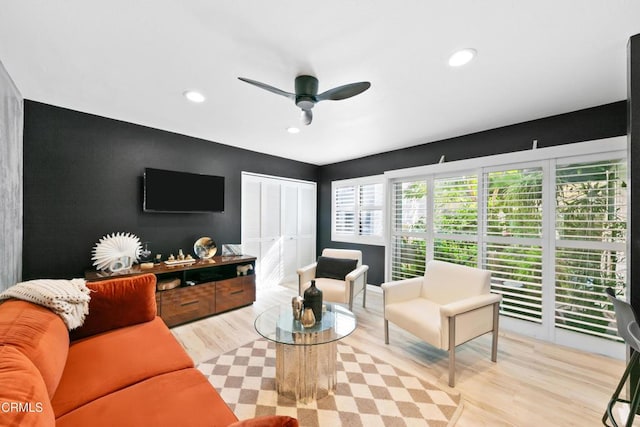 living area featuring recessed lighting, wood finished floors, and a ceiling fan