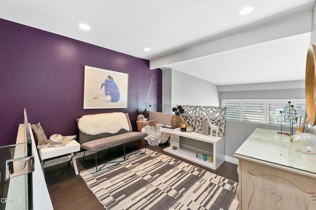 living area featuring recessed lighting, baseboards, and wood finished floors