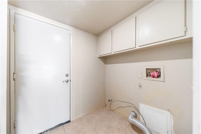 laundry room featuring light tile patterned floors, cabinet space, and hookup for a washing machine