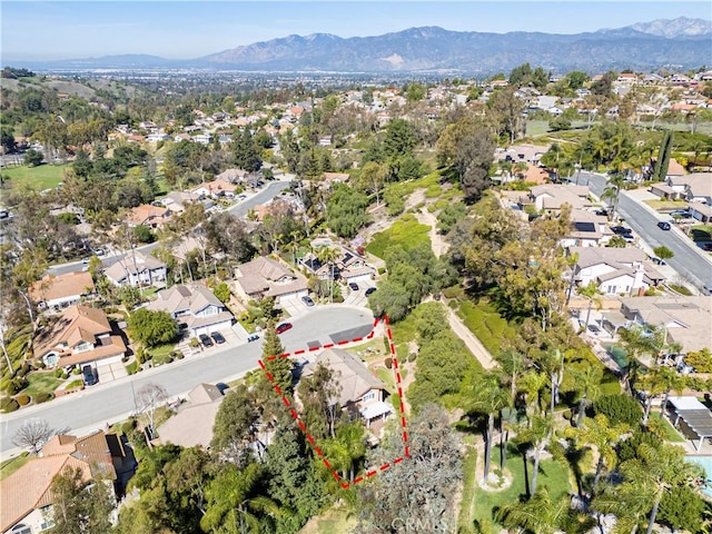 birds eye view of property featuring a mountain view and a residential view