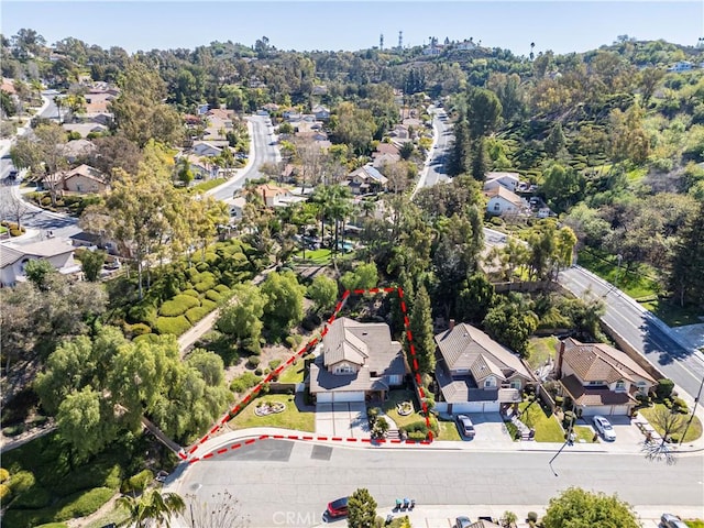 birds eye view of property with a residential view