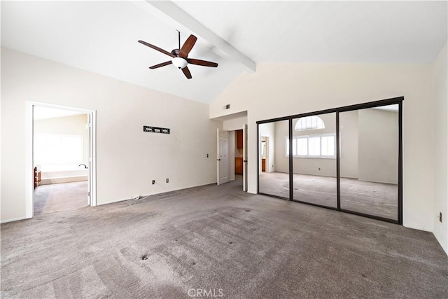 unfurnished bedroom with beamed ceiling, high vaulted ceiling, carpet flooring, and a ceiling fan