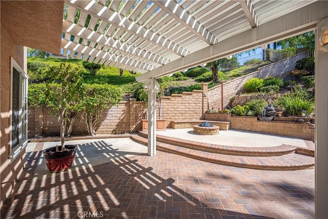 view of patio with a fire pit, a fenced backyard, and a pergola