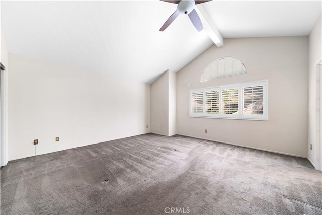 carpeted empty room with vaulted ceiling with beams and a ceiling fan