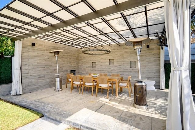 view of patio featuring outdoor dining area and a pergola