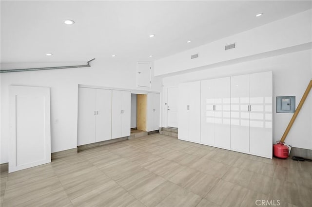 unfurnished bedroom featuring electric panel, recessed lighting, and visible vents