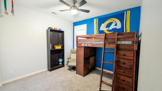 carpeted bedroom with visible vents and baseboards