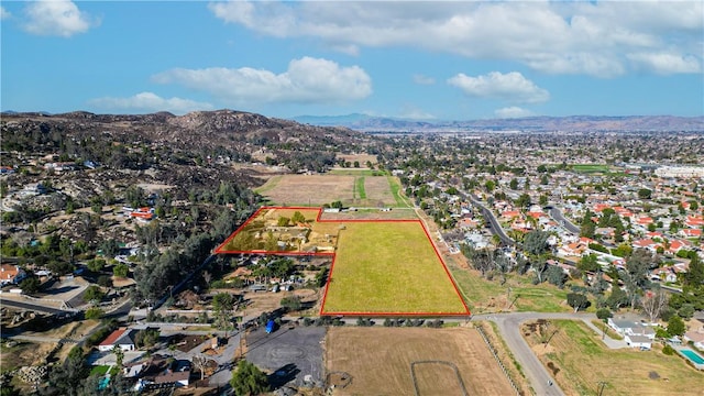 birds eye view of property featuring a mountain view