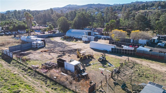 bird's eye view featuring a mountain view and a wooded view