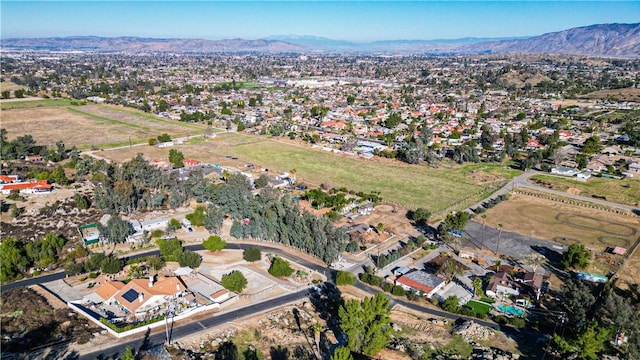 drone / aerial view featuring a residential view and a mountain view