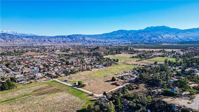 birds eye view of property with a mountain view