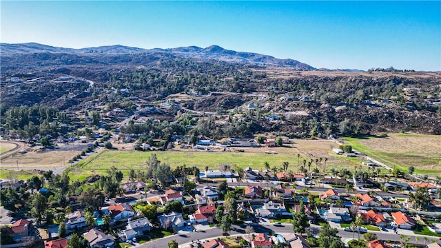 drone / aerial view featuring a mountain view and a residential view