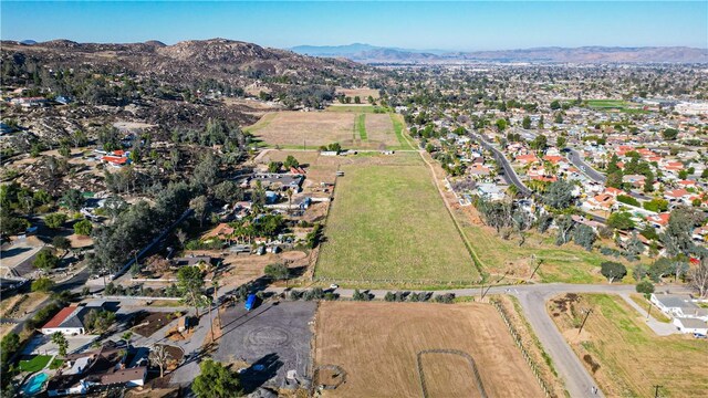 birds eye view of property with a mountain view and a rural view