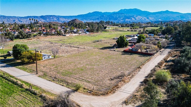 drone / aerial view featuring a rural view and a mountain view