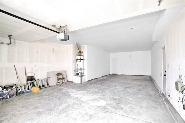 garage featuring secured water heater and a garage door opener