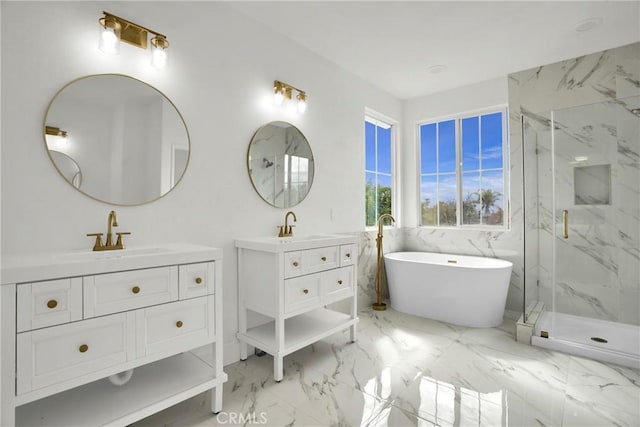 full bathroom featuring a marble finish shower, marble finish floor, two vanities, and a sink