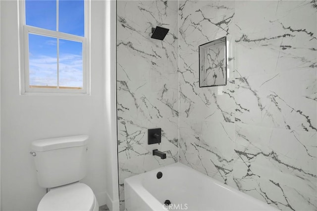 bathroom featuring toilet and bathtub / shower combination