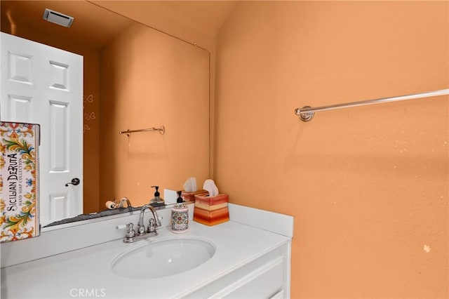 bathroom featuring visible vents and vanity