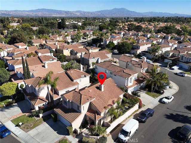 bird's eye view featuring a residential view and a mountain view