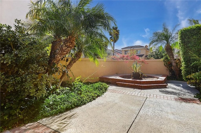 view of patio featuring fence